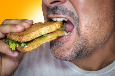 Close-up of man eating food