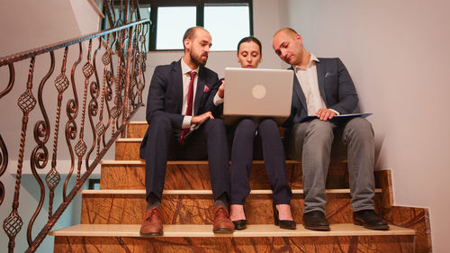 Low angle view of business colleagues working in office