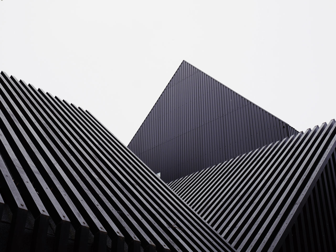 built structure, architecture, sky, building exterior, low angle view, clear sky, building, no people, pattern, copy space, city, nature, modern, day, outdoors, office, roof, striped, office building exterior, repetition, skyscraper, corrugated