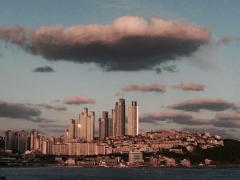 City skyline against cloudy sky