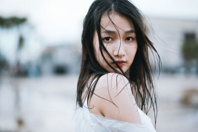 Portrait of woman standing outdoors