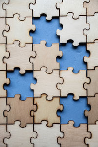 High angle view of wooden jigsaw puzzle