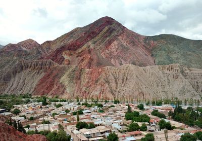 Scenic view of mountains against cloudy sky