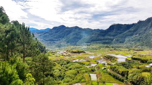 High angle view of trees and mountains against sky