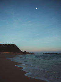 Scenic view of sea against blue sky