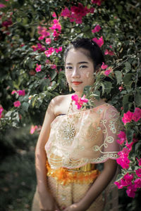 Girl in traditional clothing standing at park