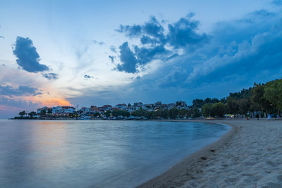 Scenic view of sea and buildings against sky