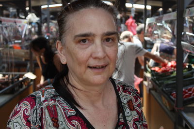 Portrait of smiling mature woman in market