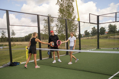 Friends playing padel