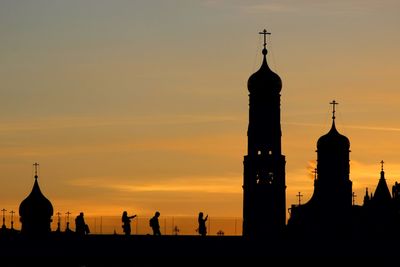 Silhouette of building against sky during sunset