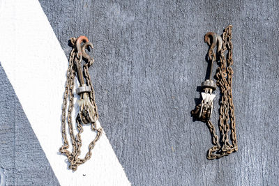 Close-up of chain hanging on wall