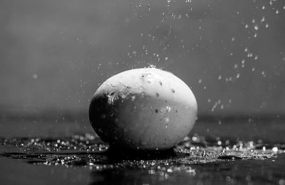 Close-up of water falling on stone