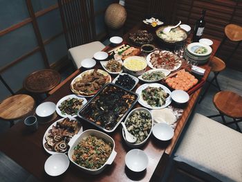 High angle of chinese food served on table