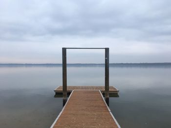 Pier over sea against sky