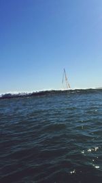 Scenic view of calm sea against clear sky