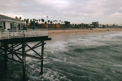 Scenic view of beach against sky in city