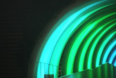 Close-up of illuminated lights against black background