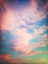 Low angle view of cloudy sky at sunset