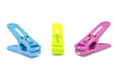 Close-up of multi colored pencils over white background