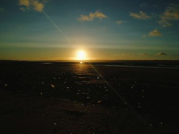 Scenic view of landscape against sky during sunset