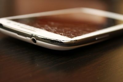 Close-up of mobile phone on table
