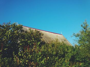 Low angle view of building against clear blue sky