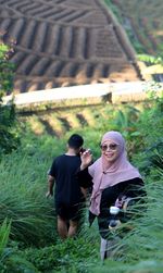 Portrait of young man standing in park