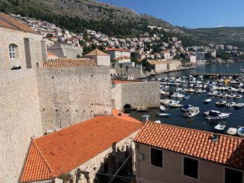 High angle view of townscape by sea