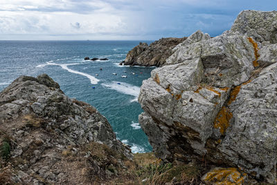 Scenic view of sea against cloudy sky