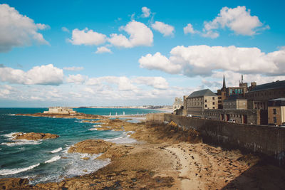 View of beach against cloudy sky