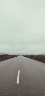 Surface level of road against the sky