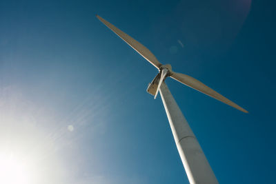 Low angle view of wind turbine against sky