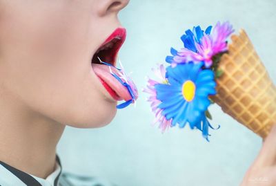 Side view of woman with flowers