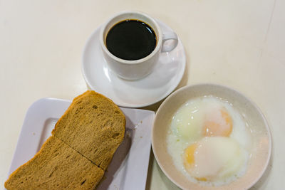 Close-up of breakfast on coffee