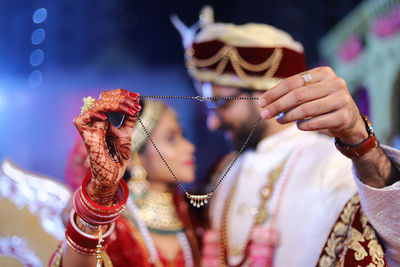 Close-up of woman holding umbrella
