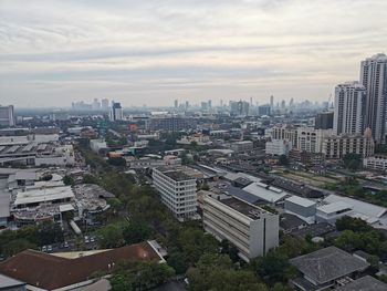 High angle view of buildings in city against sky