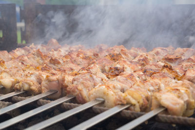 Close-up of meat on barbecue grill