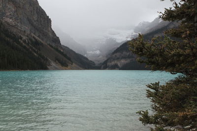 Scenic view of lake and mountains against sky