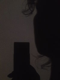 Silhouette of woman in darkroom