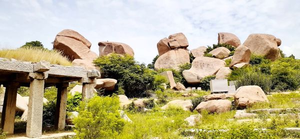 Panoramic view of rocks and trees against sky