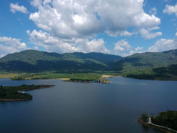 Scenic view of lake and mountains against sky