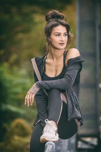 Portrait of woman sitting outdoors