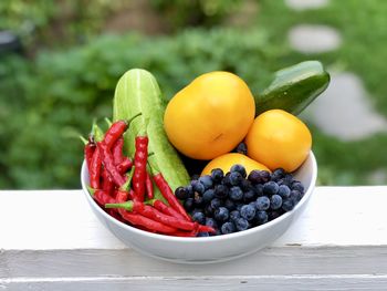 Fruits and vegetables in bowl on table