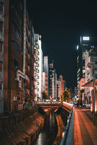 Illuminated buildings in city at night