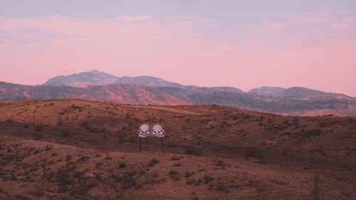 Scenic view of field against sky during sunset