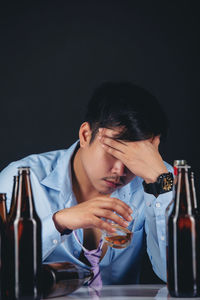 Full length of a man drinking glass