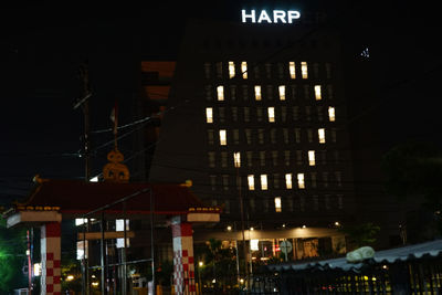Low angle view of illuminated building at night