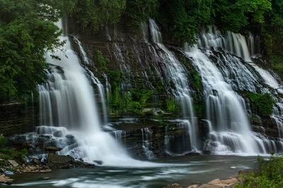 Scenic view of waterfall in forest