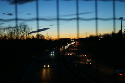 Cars on road against sky