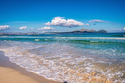 Scenic view of sea against blue sky